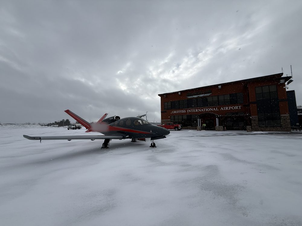 Vision Jet on a snowy ramp at Griffiss International Airport